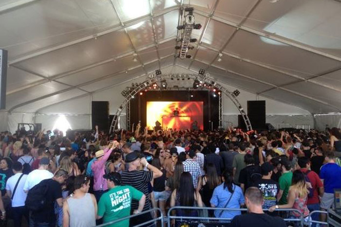 show with crowd inside tent