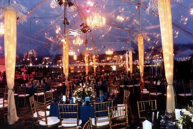 tables and lights set up inside transparent tent